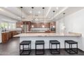 Bright kitchen with modern appliances, granite counters, and a spacious island at 4556 E Paradise Ln, Phoenix, AZ 85032