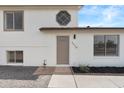 Charming home entrance featuring a neutral-colored door and well-manicured gravel landscaping at 4629 E Southern Ave, Phoenix, AZ 85042