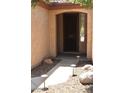 Inviting front entrance with decorative rock landscaping and stylish lighting at 4747 E Narrowleaf Dr, Gilbert, AZ 85298
