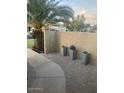 Inviting front entrance with decorative potted plants and a paved walkway at 5435 W Christy Dr, Glendale, AZ 85304