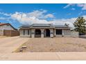 Attractive single-story home with solar panels and desert landscaping at 5702 S Beck Ave, Tempe, AZ 85283