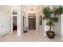 Inviting foyer with tile flooring, high ceilings, and elegant decor at 6135 E Campo Bello Dr, Scottsdale, AZ 85254