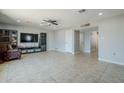 Bright living room with tile flooring, ceiling fan, and ample space for entertaining at 618 N Stapley Dr, Mesa, AZ 85203