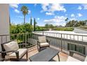 Relaxing outdoor balcony area with comfortable seating and views of the surrounding neighborhood at 7469 E Timberlane Ct, Scottsdale, AZ 85258