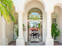 Grand entrance with arched doorways offer a captivating view of the dining room and beyond at 10800 E Cactus Rd # 34, Scottsdale, AZ 85259