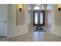 Open foyer featuring tile flooring and an elegant double door entry with sidelights at 15273 S 31St St, Phoenix, AZ 85048