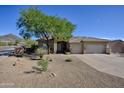 Exterior showcases desert landscaping, mature trees, and a three car garage in a suburban neighborhood at 16861 N 106Th Way, Scottsdale, AZ 85255