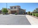 View of the home showing the landscaping, curb, sidewalk, and a two car garage at 1871 E Lantana Dr, Chandler, AZ 85286