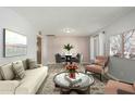 Cozy living room with neutral walls, hard surface floors, stylish furnishings and décor at 2259 E Ivy St, Mesa, AZ 85213