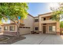 Charming two-story home featuring stucco siding, shutters, and a well-maintained front yard at 3133 N Medallion Ct, Casa Grande, AZ 85122