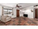 Cozy living room area with a large window and unique tile flooring throughout the space at 355 E Fillmore St, Tempe, AZ 85288
