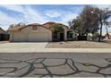 Charming single-story home with a three-car garage and well maintained landscaping at 3601 E Taro Ln, Phoenix, AZ 85050