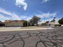 Street view of a single-story home with a three-car garage and desert landscaping at 3601 E Taro Ln, Phoenix, AZ 85050
