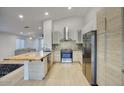 Modern kitchen featuring stainless steel appliances, sleek cabinetry, and a breakfast bar at 3604 W Calle Lejos --, Glendale, AZ 85310