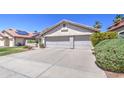 Well-maintained home with a spacious three-car garage and neatly landscaped front yard offers great street presence at 3834 E Windsong Dr, Phoenix, AZ 85048