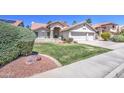 Attractive single-Gathering home boasts a lush, green lawn and a three-car garage, showcasing curb appeal at 3834 E Windsong Dr, Phoenix, AZ 85048
