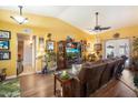 Comfortable living room featuring yellow walls, hard floors, and natural light at 3926 W Christy Dr, Phoenix, AZ 85029