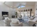 Bright living room boasts a fireplace, plush seating, and an abundance of natural light at 4116 E Sunnyside Dr, Phoenix, AZ 85028