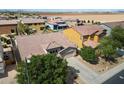 Aerial view of a well-maintained home featuring desert landscaping and a tile roof in a modern neighborhood setting at 43998 W Palo Abeto Dr, Maricopa, AZ 85138