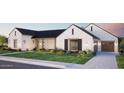 Single-Gathering home featuring manicured lawn, dark trim windows, and a paved driveway to a two-car garage at 5941 E Lafayette Blvd, Phoenix, AZ 85018
