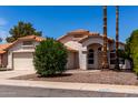 Charming single-story home with a two-car garage and a well-maintained front yard at 626 W Catclaw St, Gilbert, AZ 85233