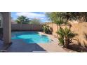 Enjoy the Arizona weather with a private pool and decorative plantings at 7318 W St Charles Ave, Laveen, AZ 85339
