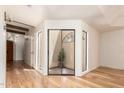 Bright living space featuring wood floors, a courtyard view, and neutral walls with a modern feel at 7955 E Chaparral Rd # 141, Scottsdale, AZ 85250