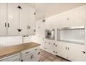 Cozy kitchen featuring white cabinets, stainless steel oven and butcher block countertop at 8121 N 8Th Ave, Phoenix, AZ 85021