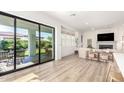 Bright open concept with a large sliding glass door to the patio and neutral decor at 10206 E Texas Ave, Mesa, AZ 85212
