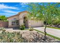 Inviting single-story home showcasing desert landscaping and a covered entryway at 1049 N Monterey St, Gilbert, AZ 85233
