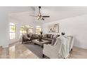Bright and spacious living room with vaulted ceilings, arched windows, and stylish furniture at 12853 E Yucca St, Scottsdale, AZ 85259