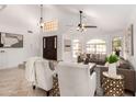 Open-concept living area with high ceilings, chandelier, and seamless flow to other spaces at 12853 E Yucca St, Scottsdale, AZ 85259