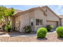 View of charming single-story home showcasing the low-maintenance front yard with desert landscaping at 1577 E Earl Dr, Casa Grande, AZ 85122
