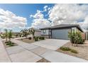 Street view features a single-Gathering home with desert landscaping and a private two-car garage at 17376 W Via De Luna Dr, Surprise, AZ 85387