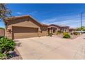 Lovely single-story home with a two-car garage and low-maintenance desert landscaping at 17836 N 52Nd Pl, Scottsdale, AZ 85254