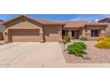 Charming single-story home featuring a two-car garage and beautifully landscaped front yard at 17836 N 52Nd Pl, Scottsdale, AZ 85254