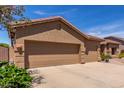 Exterior image of a home showcasing a spacious two-car garage and well-maintained facade at 17836 N 52Nd Pl, Scottsdale, AZ 85254