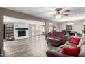 Inviting living room with a cozy fireplace, neutral paint, and contemporary decor at 2001 W Surrey Ave, Phoenix, AZ 85029