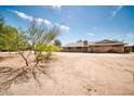Single-story brick home with desert landscaping on a large lot at 2024 N 200Th Ave, Buckeye, AZ 85396