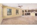Bright and airy living room featuring carpeted floors, large windows, and an open floor plan at 22123 E Vía Del Palo --, Queen Creek, AZ 85142
