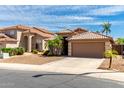 Attractive single-Gathering home with a well-maintained desert front yard and two-car garage at 2503 E Camellia Dr, Gilbert, AZ 85296
