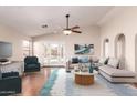Bright living room features vaulted ceilings, hardwood floors, and stylish decor at 2503 E Camellia Dr, Gilbert, AZ 85296