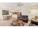 Open-concept living area with a dining table, kitchen view, and comfortable seating at 2734 W Bowker St, Phoenix, AZ 85041