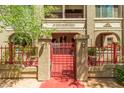 Inviting gated entrance to the building, featuring detailed stonework at 387 N 2Nd Ave # F2, Phoenix, AZ 85003