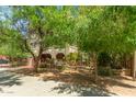Well-kept building with mature trees providing shade and curb appeal at 387 N 2Nd Ave # F2, Phoenix, AZ 85003