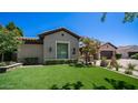 Charming home featuring manicured lawn, desert landscaping, and attractive exterior finishes at 4281 S Iowa St, Chandler, AZ 85248