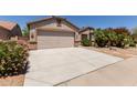 Charming single-Gathering home with desert landscaping, covered entry, and a two-car garage at 43344 W Oster Dr, Maricopa, AZ 85138