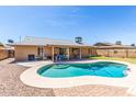 Sparkling pool and covered patio, perfect for outdoor entertaining at 5320 W Maui Ln, Glendale, AZ 85306