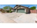 This charming home features a well-manicured yard, three-car garage, and a convenient corner lot location at 6002 N 124Th Dr, Litchfield Park, AZ 85340