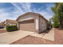 Single-story home with a two-car garage and desert landscaping at 10808 W Ruth Ave, Peoria, AZ 85345